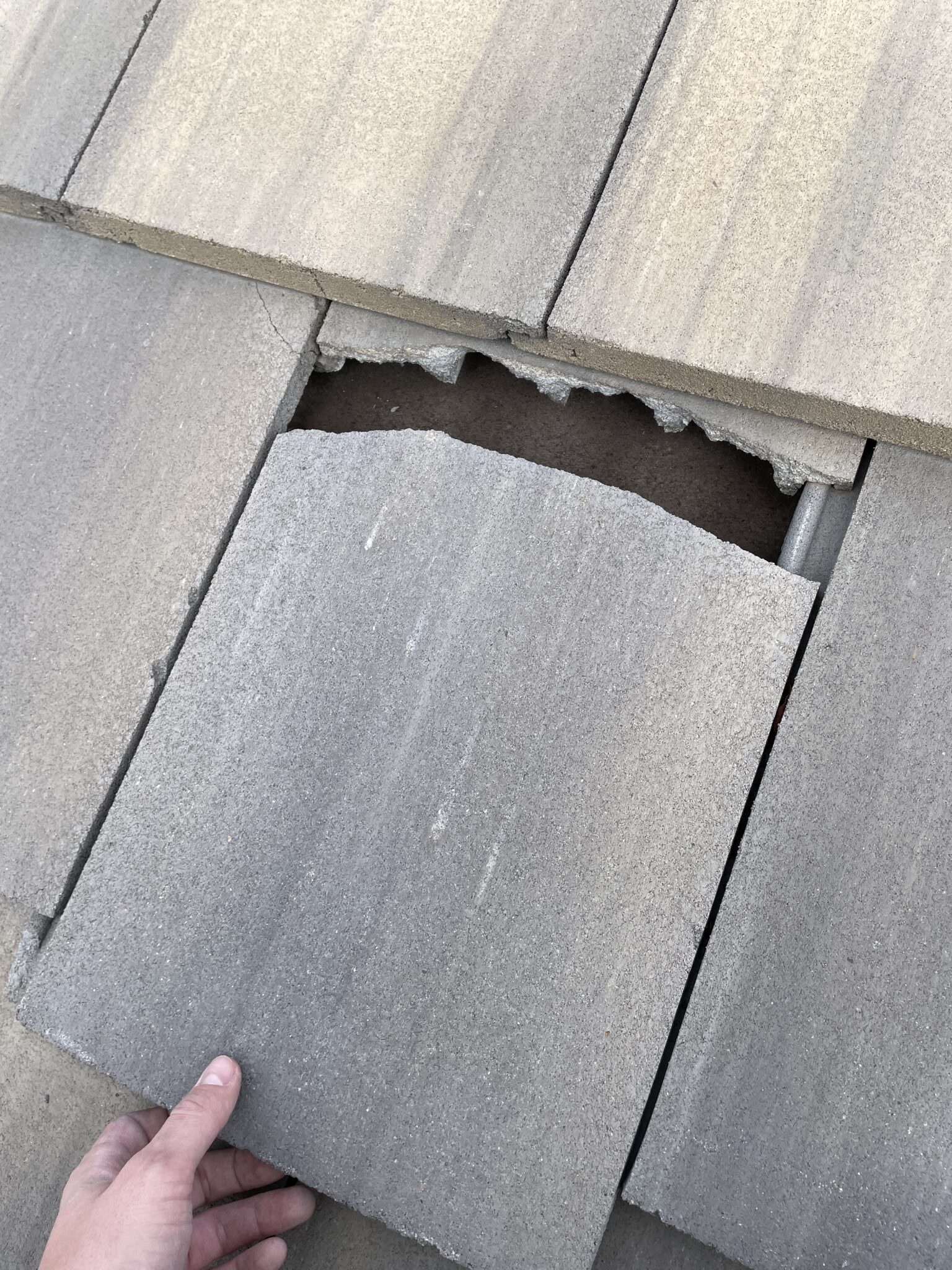 Broken roof tile in need of repair